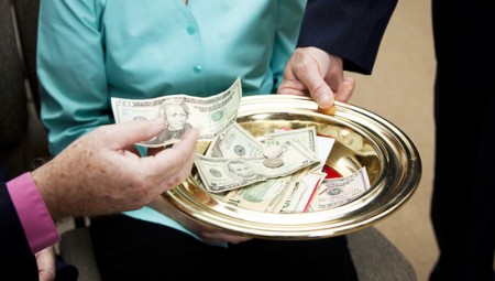 Church members putting money in the collection plate.
charitable contribution blog